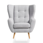 Fotel LAHTI uszak pikowany na drewnianych nóżkach