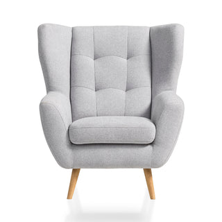 Fotel LAHTI uszak pikowany na drewnianych nóżkach