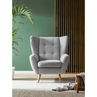 Fotel LAHTI uszak pikowany na drewnianych nóżkach