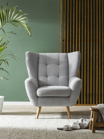 Fotel LAHTI uszak pikowany na drewnianych nóżkach