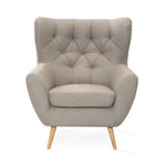 Fotel uszak VOSS pikowany na drewnianych nóżkach