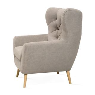 Fotel uszak VOSS pikowany na drewnianych nóżkach